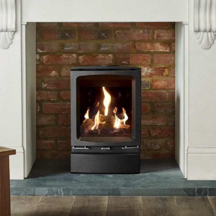 Modern gas fireplace with flames inside a brick surround with Vogue Midi Rear Exit BF flue