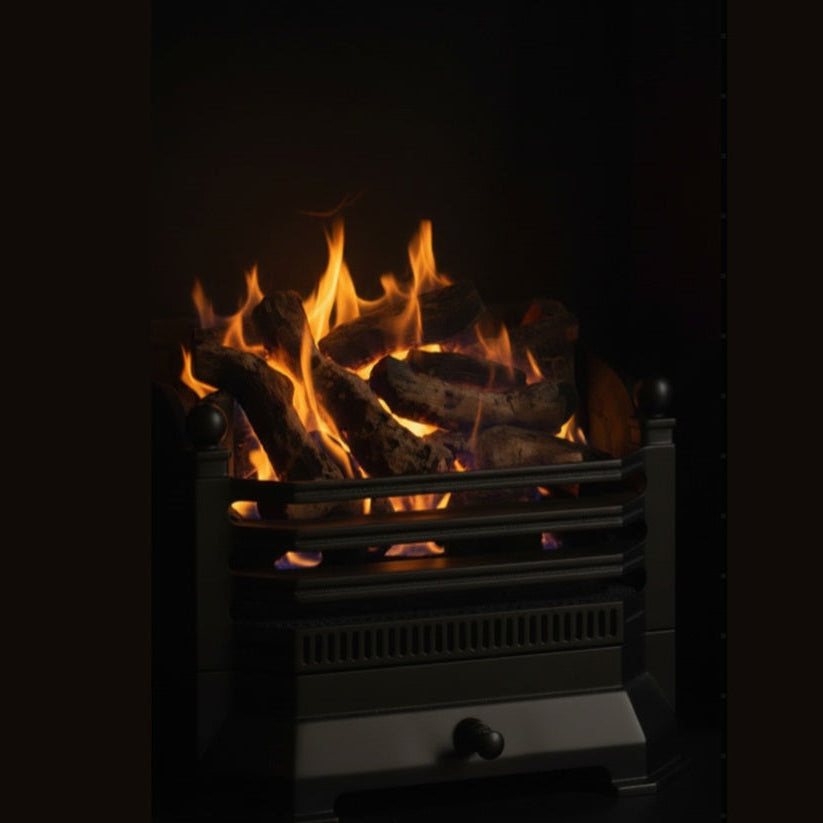 A black Fretted Gas 2050 fire insert with glowing orange and yellow flames over realistic-looking faux logs, set against a dark background.