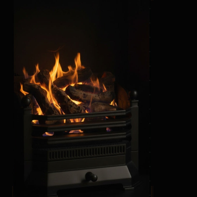 A 2050 Log gas fire insert with a black metal grate and front drawer, featuring realistic orange and yellow flames over dark faux logs against a black background.