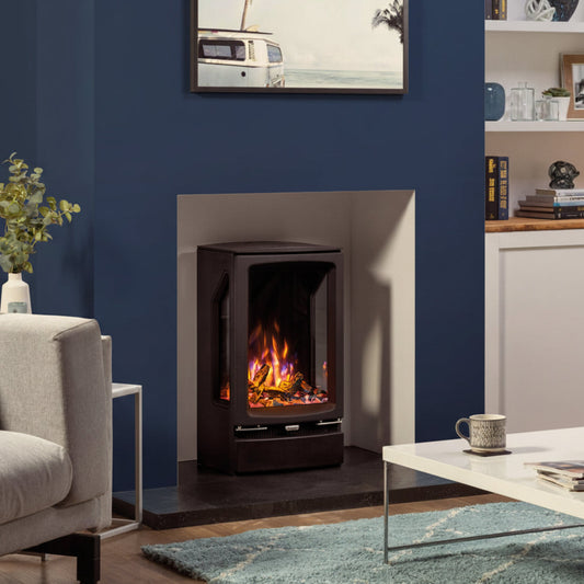 Modern living room with a Gazco Vogue T Electric Stove fireplace against a blue wall