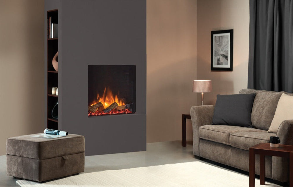 Living room with a gray electric fireplace, beige sofa, and side table.