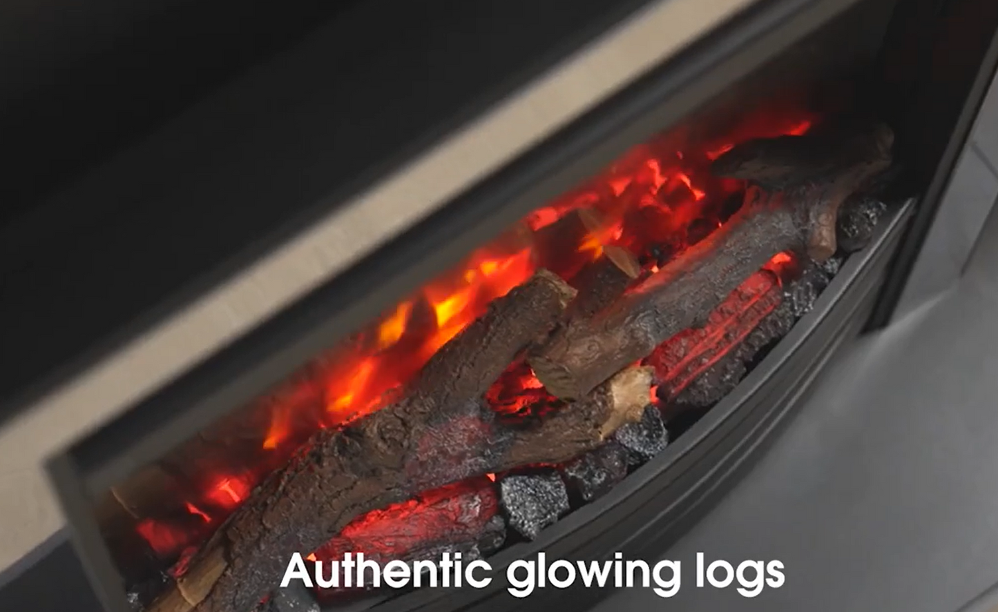 Close-up of glowing logs in a fireplace with text 'Authentic glowing logs'.