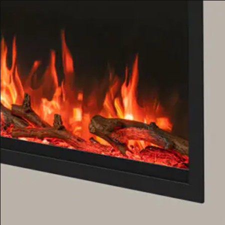 Close-up of an electric Atmos Fire FX Versa Range fireplace insert showing glowing orange and red flames, faux logs, and glowing embers inside a black frame.