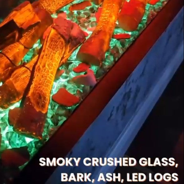 Decorative Log Green Aquarian Fuel Bed setup with smoky crushed glass, bark, ash, and LED Orange log effect.