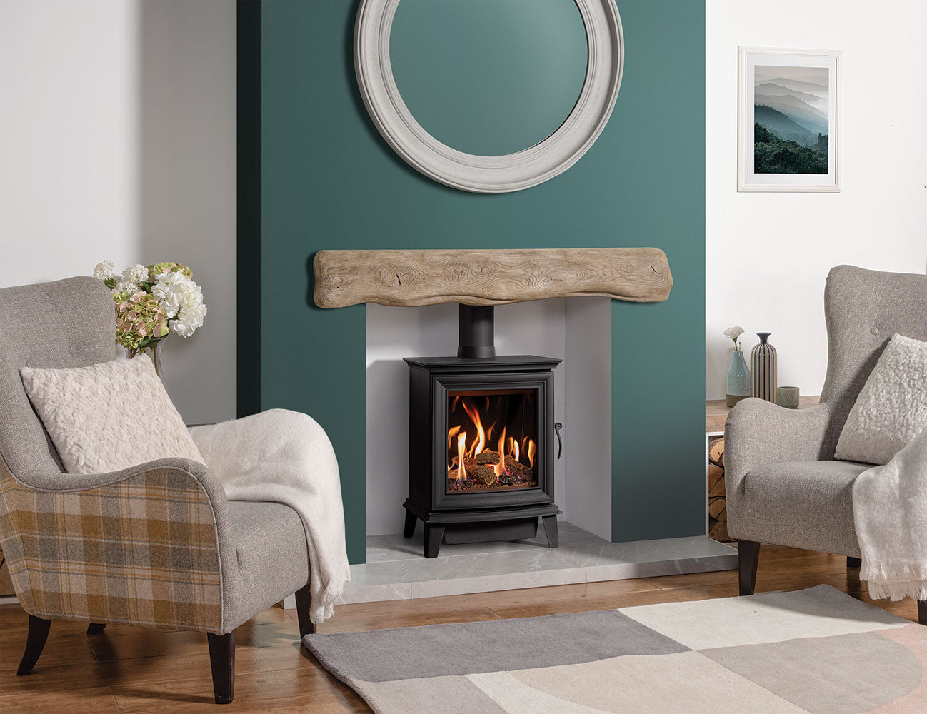 Gazco Chesterfield Gas Stove in Living room with a Olive Green fireplace, two armchairs, and decorative elements.