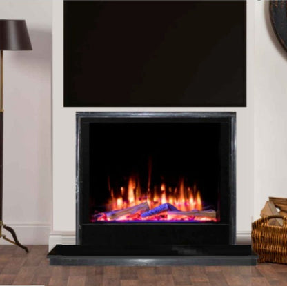 Electric fireplace with glowing logs in a room with a lamp and basket with Iconic 750 Electric Fire HD750 Solarflame Multi-Sided Electric Fire