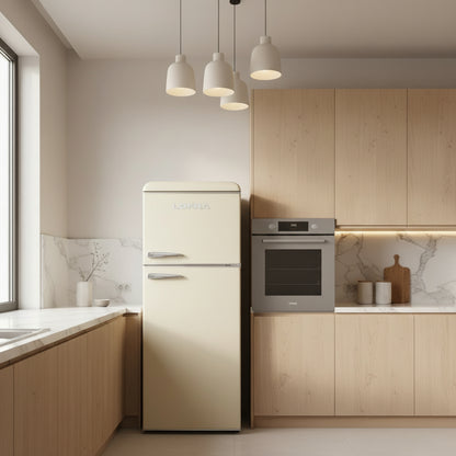 A Lofra retro-style top-freezer refrigerator in a champagne gold finish with chrome handles, shown on a plain white background with a 'Made in Italy' shield icon in the top right corner.