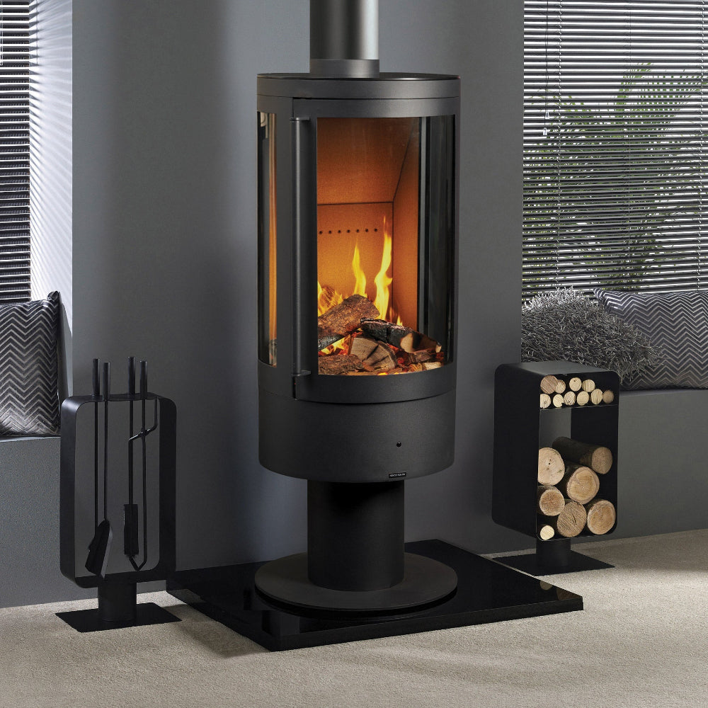 Modern Elegance black freestanding cylindrical electric stove with flames and logs inside, surrounded by decorative elements.