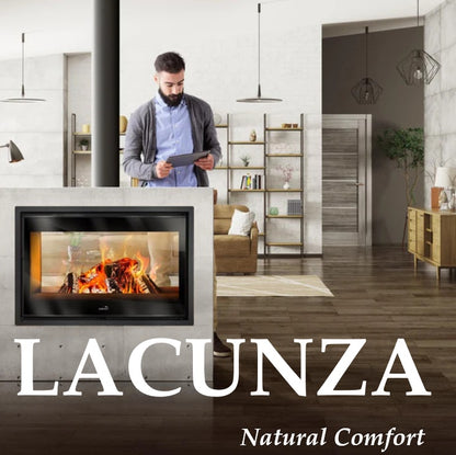 Man using a tablet in a modern living room with a Lacunza Double Sided Log Burning Fireplace.