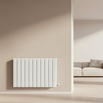 White radiator on a beige wall with a modern living room setting Smart Electric Radiators Heat Design Range the Energy Efficient Electric Heating for Ireland