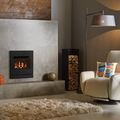 Modern living room with a fireplace, armchair, and decorative items.