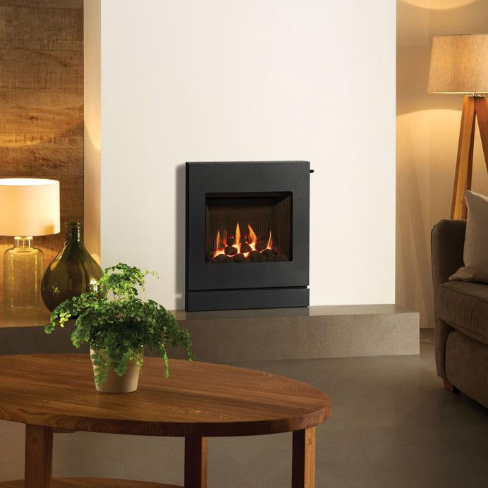 Modern living room with a fireplace, wooden table, and decorative items.