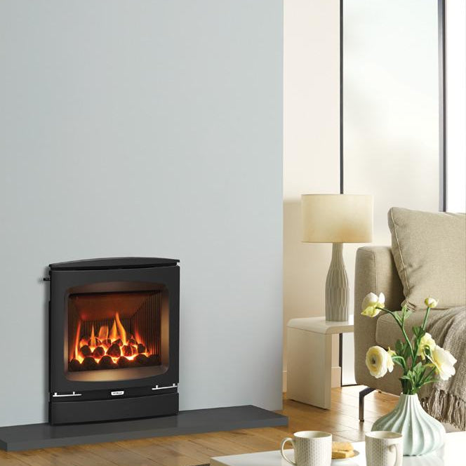 Modern living room with a fireplace, coffee table, and decorative items.