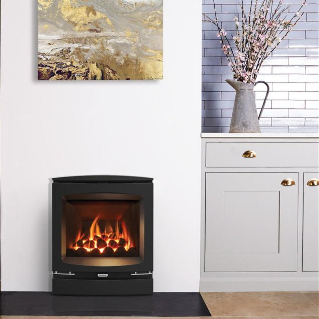 Modern stove in a room with a wooden stool and decorative elements.