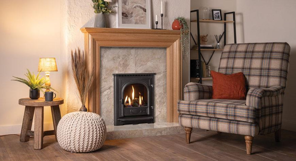 Cozy living room with a fireplace, armchair, and decorative items and Gazco Stockton Gas Fire