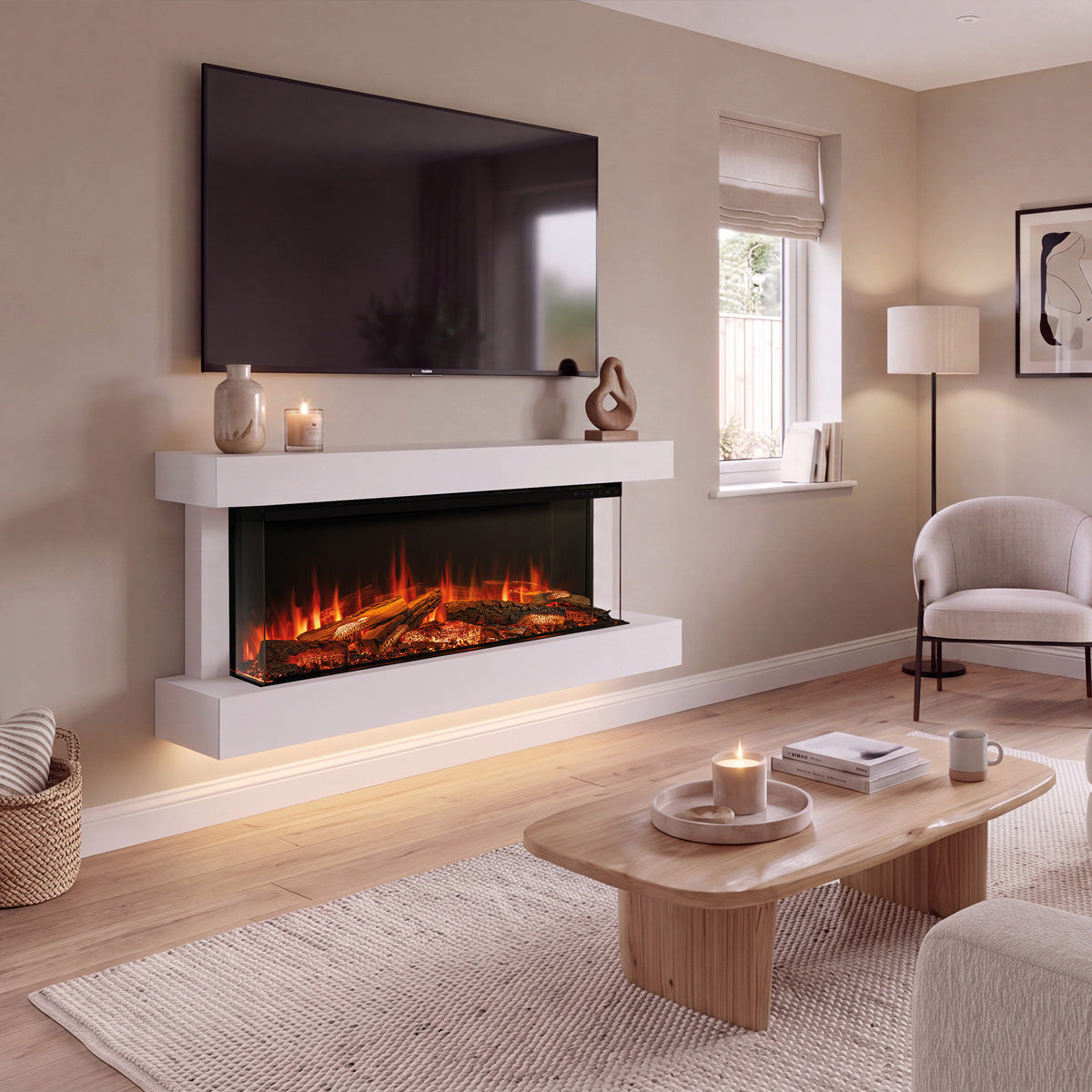 A modern floating electric fireplace mounted on a beige wall in a styled living room. The fireplace has a white floating mantel and frame with glowing orange and yellow faux flames inside.