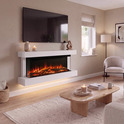 A modern floating electric fireplace mounted on a beige wall in a styled living room. The fireplace has a white floating mantel and frame with glowing orange and yellow faux flames inside.