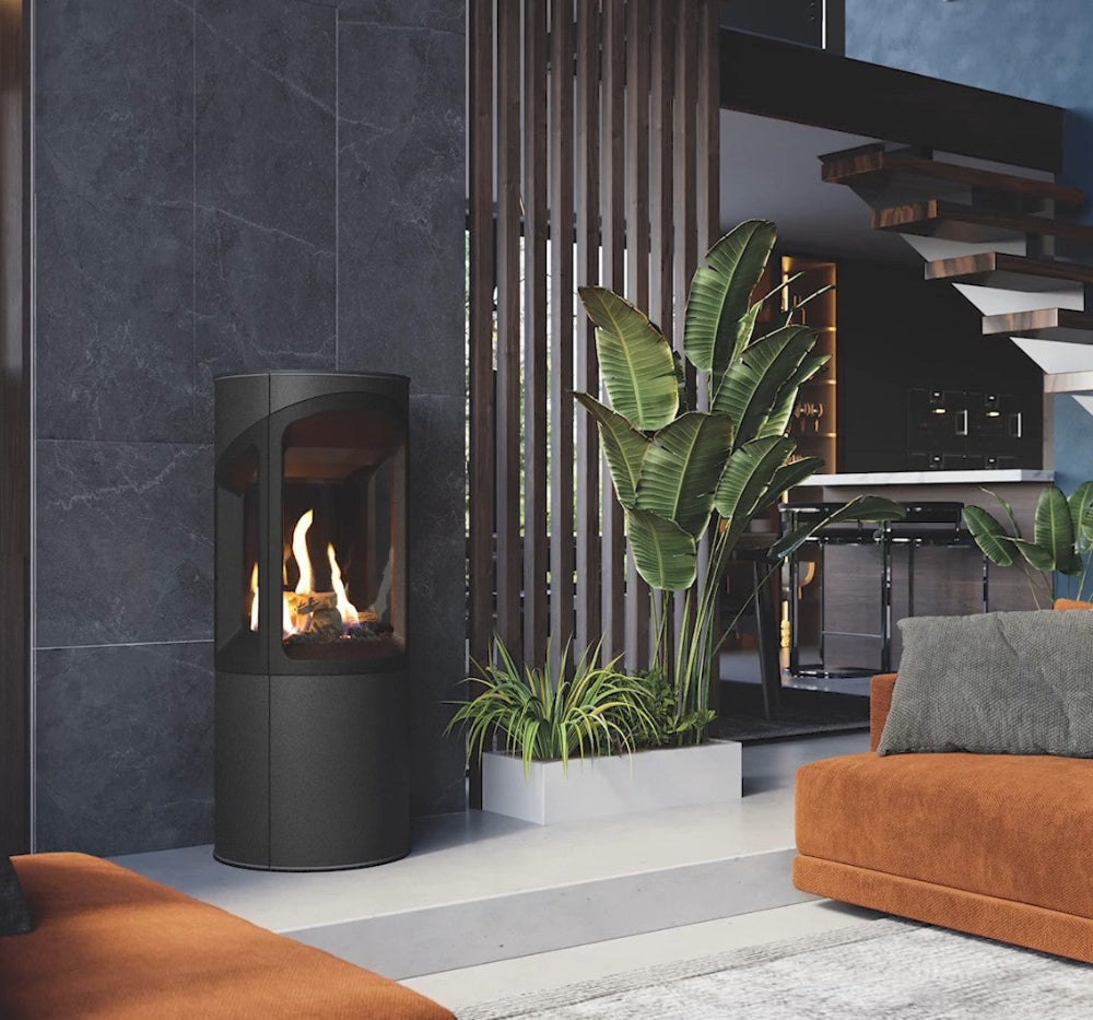 Onyx Liv 3 Gas Stove High Efficiency Gas Stove Ireland Contemporary Log Effect Gas Stove in a Modern living room with a black freestanding fireplace, orange sofa, and decorative plants