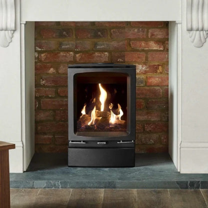 Modern gas fireplace with flames inside a brick surround with Vogue Midi Rear Exit BF flue