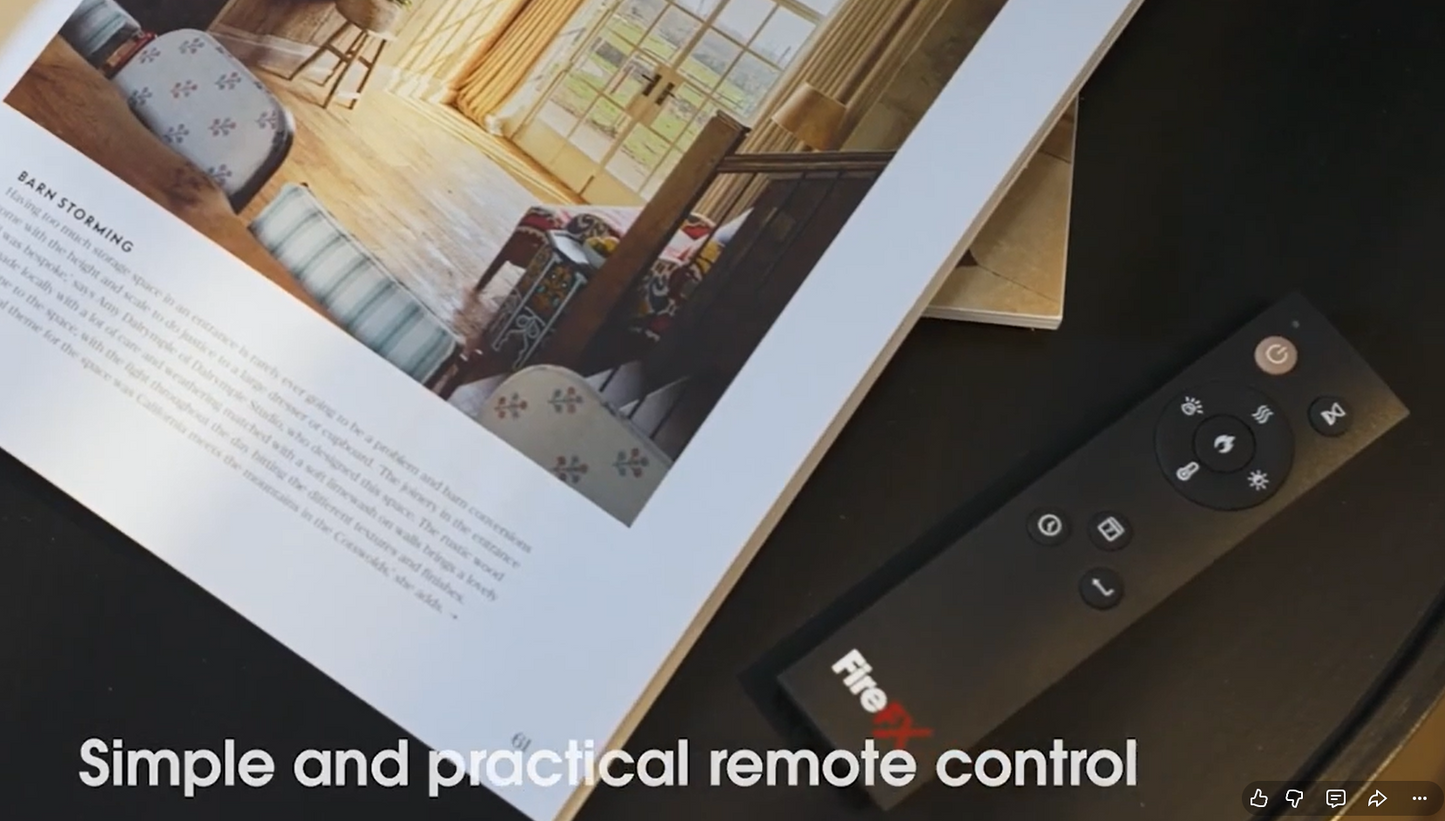 Remote control on a surface with a magazine or book in the background