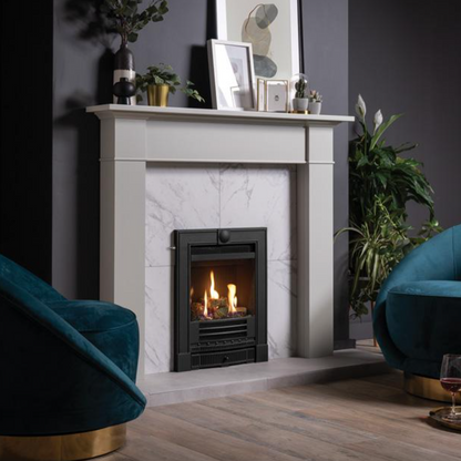 Living room with a fireplace, teal chairs, and decorative items.
