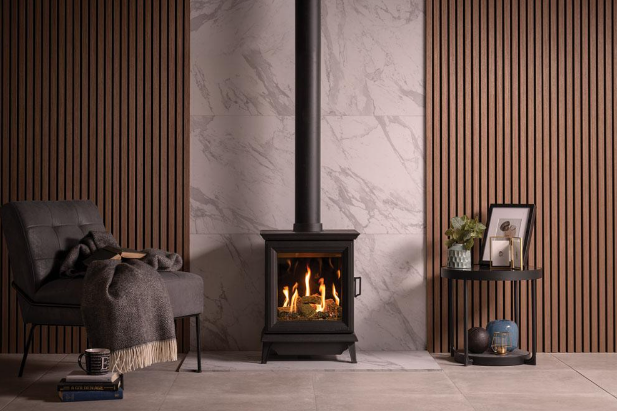 Gazco Sheraton in a Modern living room with a wood stove, chair, and decorative items.