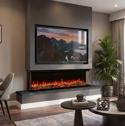 A modern wall-mounted electric Atmos Fx Versa 165w fireplace with a black frame and glowing orange flames, set into a dark gray wall above a built-in shelf. A large framed mountain landscape print is displayed on the wall above the fireplace.