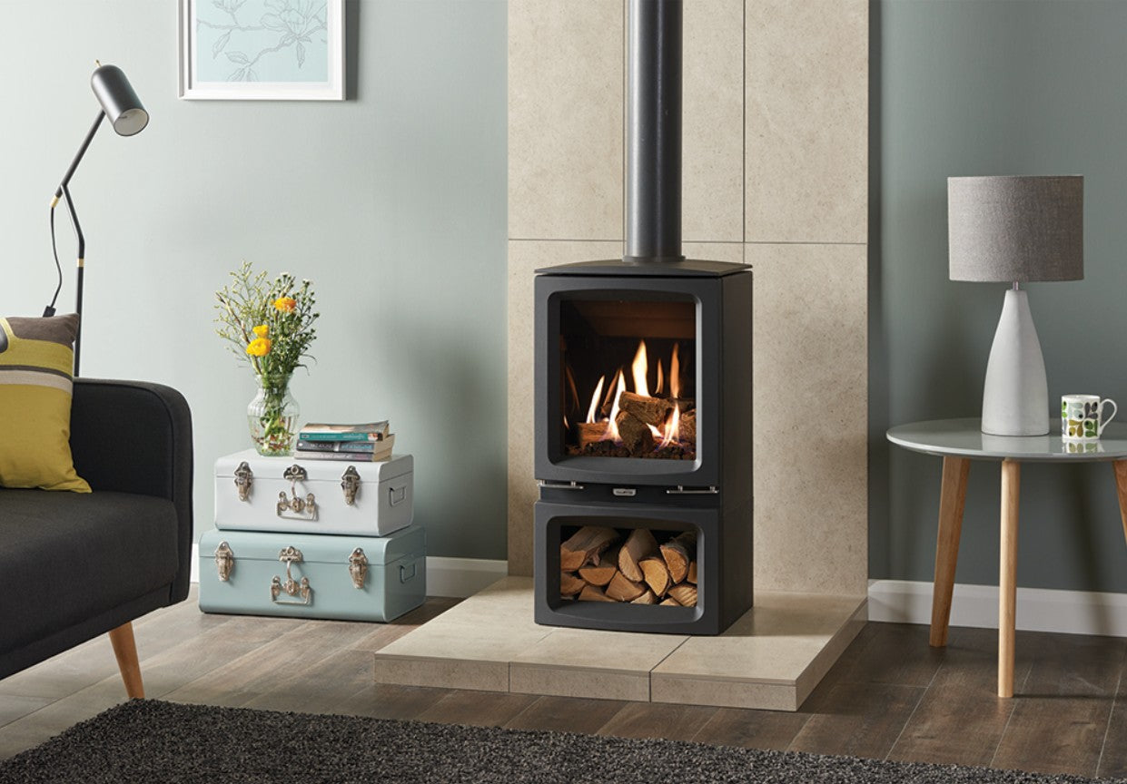 Gazco Vogue Midi Midline with Log Box in Modern living room with a freestanding stove, gray walls, and decorative elements.