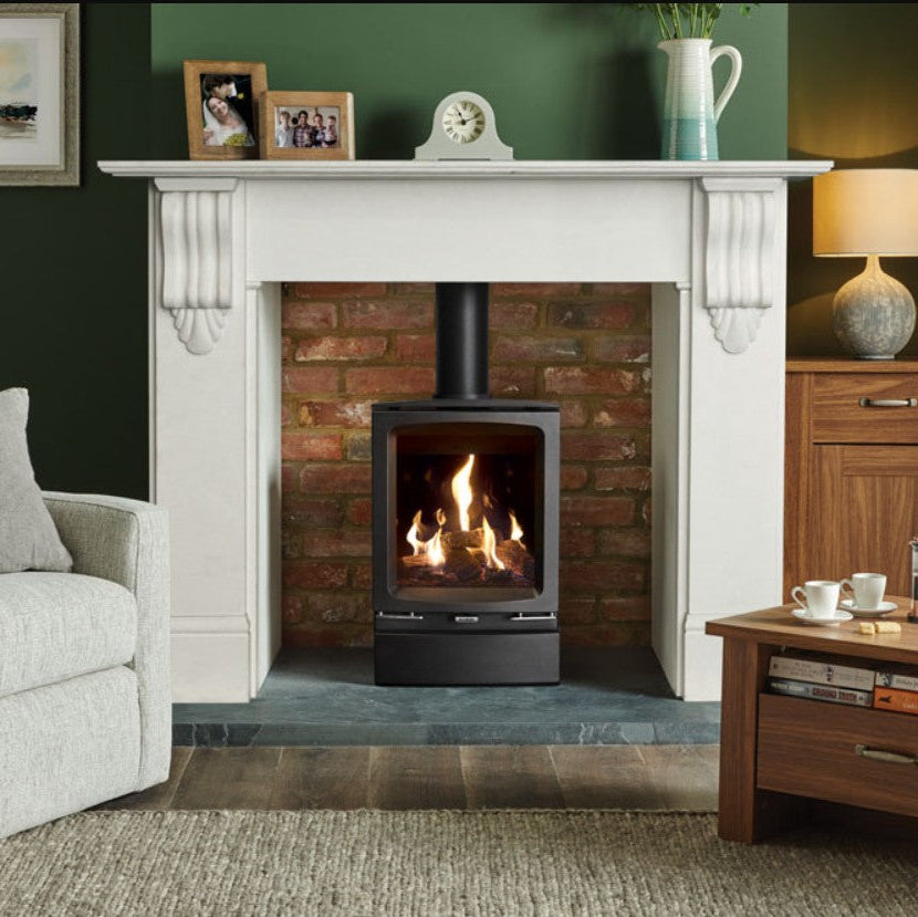 Living room with a fireplace, armchair, and coffee table with Vogue midi BF