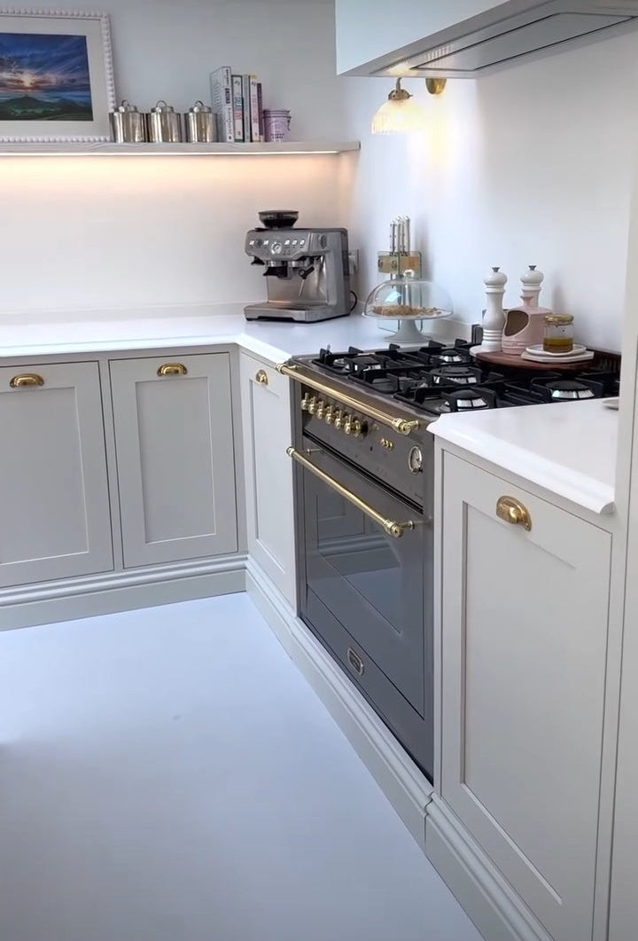 Modern kitchen with white cabinets and stainless steel Lofra Integrated Range Cooker 