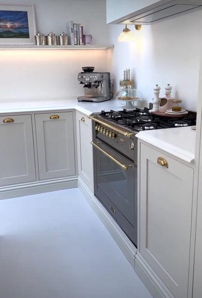 Modern kitchen with white cabinets and stainless steel Lofra Integrated Range Cooker 