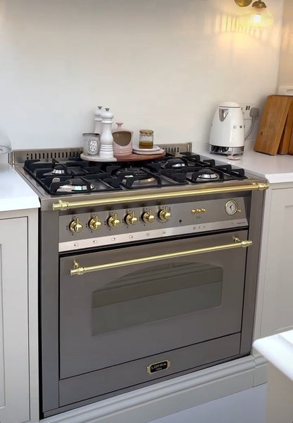 Lofra Stainless steel Integrated Range Cooker oven in a kitchen setting with a light background
