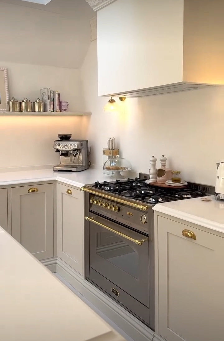 Lofra Stainless steel Integrated Range Cooker oven in a kitchen setting with a light background